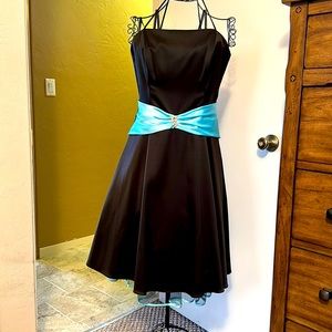 Darling prom dress falls just below the knee with a blue lined tulle visible.